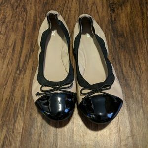 Nude and black flats